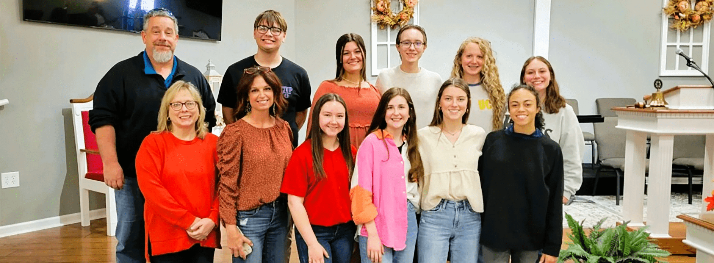 Rotary-Travel-Photo-1 People standing in front of church auditorium