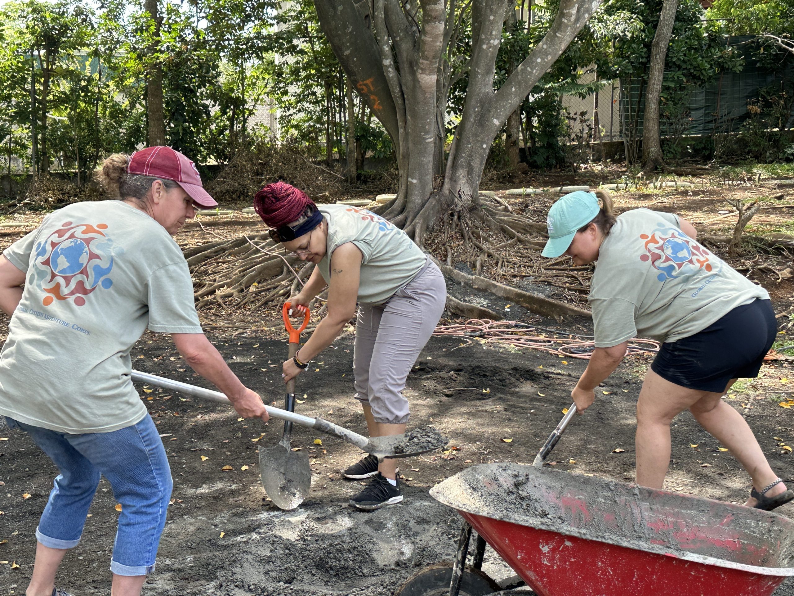 GCAC Costa Rica – Christine Fox, Kristina Franklin, Misty Evans three women shovel rocks